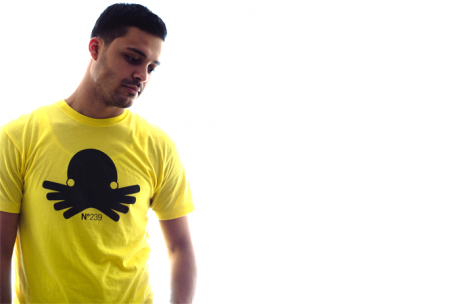 Mike Gomes wearing our octopus tri-blend tee in yellow